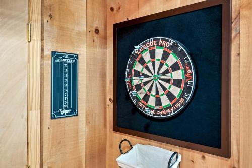 a dart board on a wall with a dartboard at Bluff Mountain's Private Retreat in Sevierville