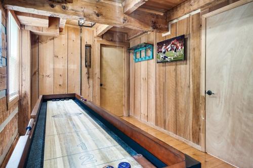 a swimming pool in a room with wooden walls at Bluff Mountain's Private Retreat in Sevierville