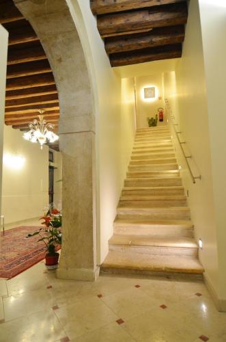 a staircase in a building with a vaulted ceiling at Albergo al Tiepolo in Venice