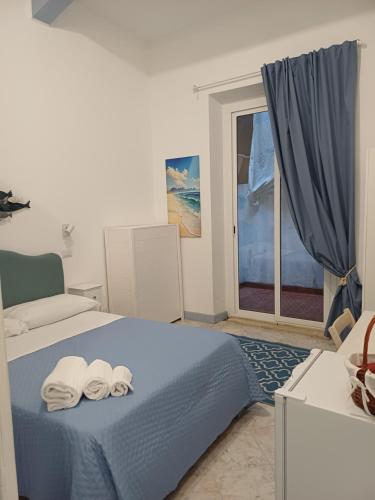 Giường trong phòng chung tại Le Stanze del Mare - B&B