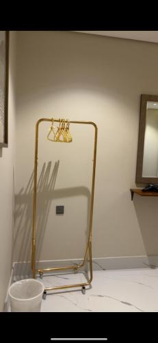 a metal rack in a room with a mirror at Chicago Apartment in Al Khobar