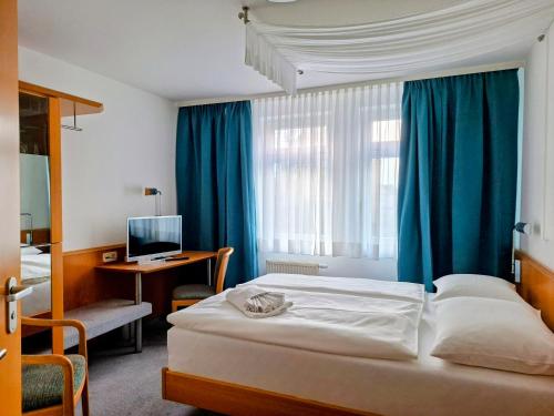 Ένα ή περισσότερα κρεβάτια σε δωμάτιο στο Vlachos Hotel