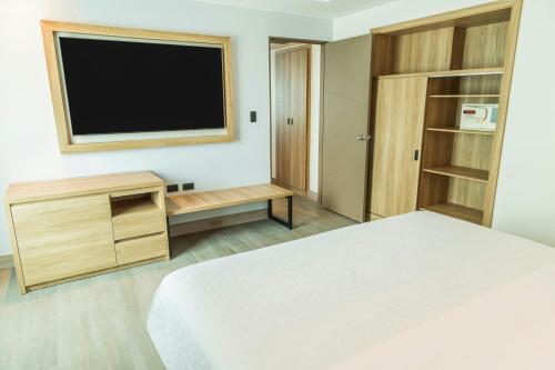 Ένα ή περισσότερα κρεβάτια σε δωμάτιο στο Sheraton Guayaquil