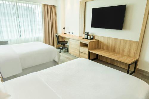 Ένα ή περισσότερα κρεβάτια σε δωμάτιο στο Sheraton Guayaquil