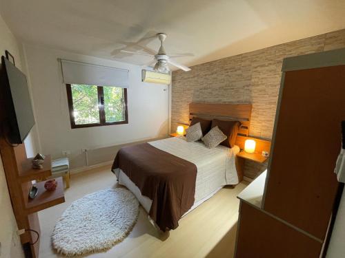 Ένα ή περισσότερα κρεβάτια σε δωμάτιο στο Lysa Paraná