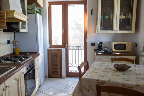 a kitchen with a table with a table cloth on it at Al Primo Piano in Forio d'Ischia