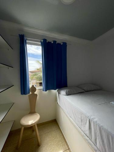 Ένα ή περισσότερα κρεβάτια σε δωμάτιο στο Pousada Bellmar - Praia Peró 5 min andando