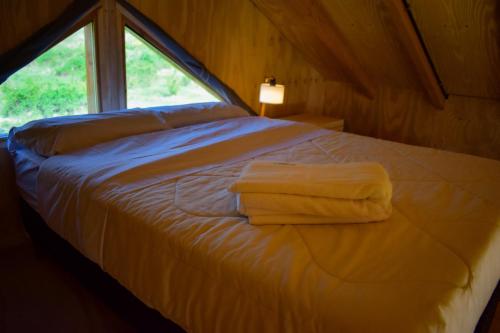 Postel nebo postele na pokoji v ubytování Chalet con vistas a las montañas