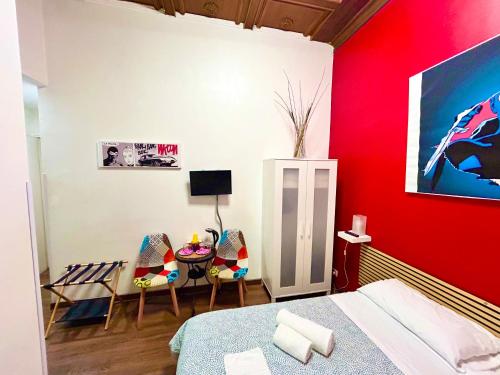 Una televisión o centro de entretenimiento en Core De Roma Suites