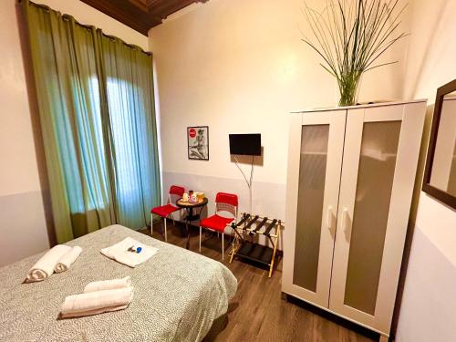 Una cama o camas en una habitación de Core De Roma Suites