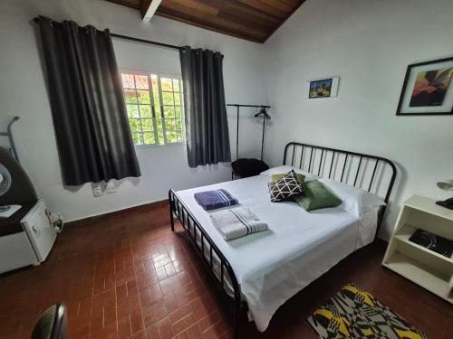 Postel nebo postele na pokoji v ubytování Chalé de Sampa