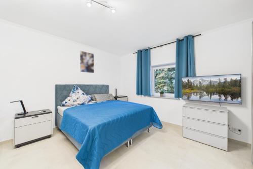 Ένα ή περισσότερα κρεβάτια σε δωμάτιο στο Attraktive Neubau Bei Zwei Buchen