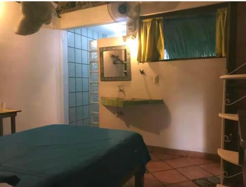 Postel nebo postele na pokoji v ubytování Punta bungalows