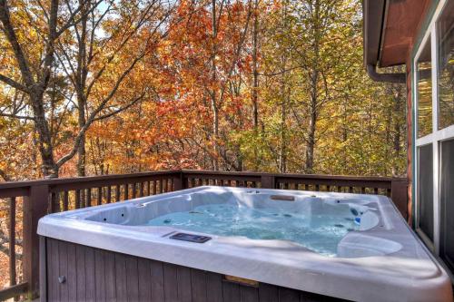 a hot tub on the deck of a house at New Mtn Views Hot Tub Arcade Chess in Sautee Nacoochee