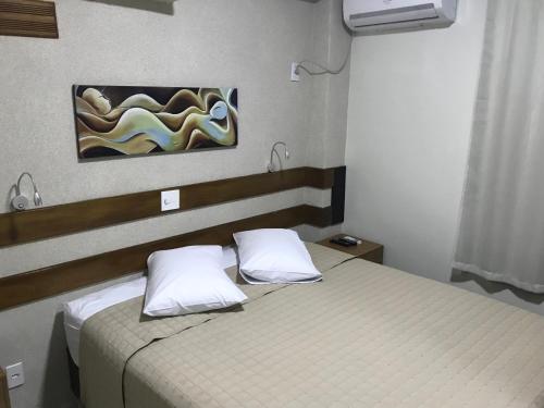 Postel nebo postele na pokoji v ubytování Hotel King