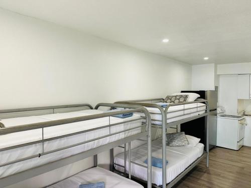 a room with two bunk beds and a kitchen at Casa Miami in Miami