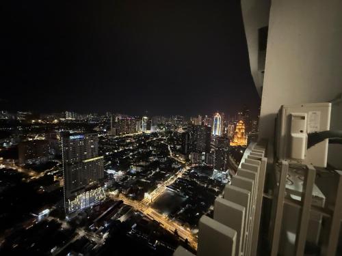 an aerial view of a city at night at Infinitum Luxurious Sky Suites in Kuala Lumpur