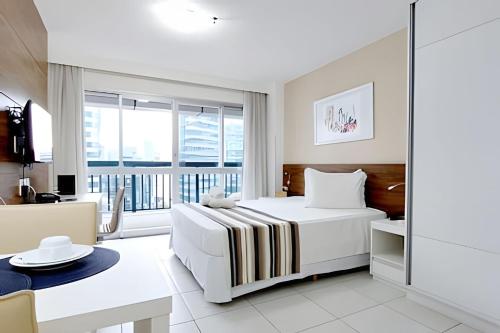 Ένα ή περισσότερα κρεβάτια σε δωμάτιο στο Vision, local nota 10! Academia, sauna e piscinas.