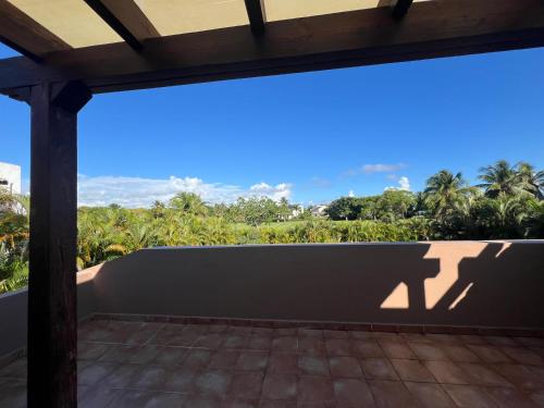 a view from the balcony of a house at Apartment with garden views 525 in Punta Cana
