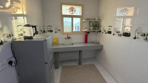 Η κουζίνα ή μικρή κουζίνα στο Alnoor apartment