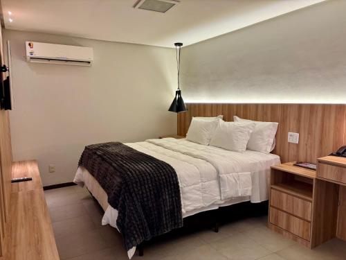 Ένα ή περισσότερα κρεβάτια σε δωμάτιο στο Flats no Hotel Mercure Belém Boulevard