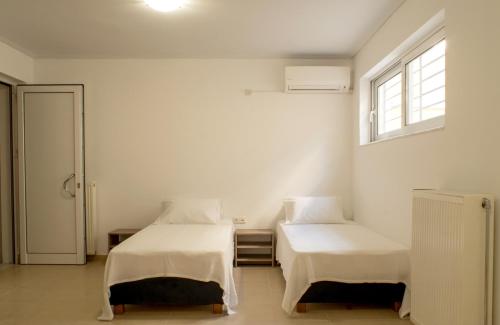 En eller flere senger på et rom på Elvita Spata Luxurious Villa