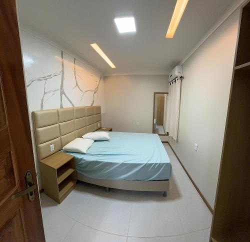 Ένα ή περισσότερα κρεβάτια σε δωμάτιο στο Flets da Cris