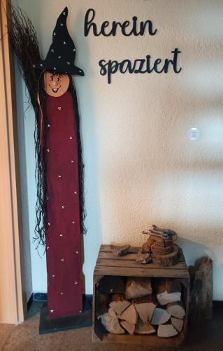a figurine of a witch standing next to a table at Casa del Norte in Brackenheim