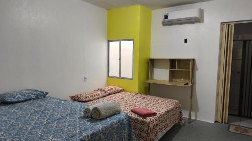 Postel nebo postele na pokoji v ubytování Quitinetes Beira Rio