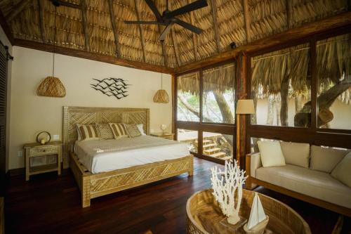 Voodi või voodid majutusasutuse All-Inclusive Sapodilla Private Island toas