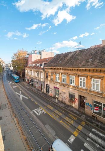 an empty street in a city with buildings at Virtus Apartments and Rooms with Free Private Parking in Zagreb