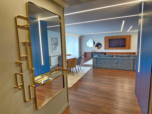 a door to a living room with a dining room at Luxury Rooftop Apartment by LuxiStay – Private Jacuzzi & Sunset Views | Matosinhos in Matosinhos