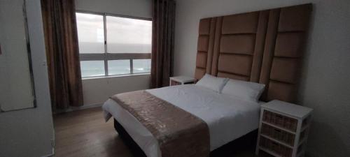 Postel nebo postele na pokoji v ubytování Sand & Sea Holiday Accommodation