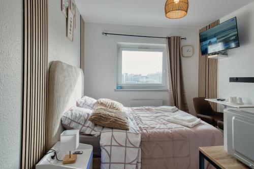Llit o llits en una habitació de Avenue Foch