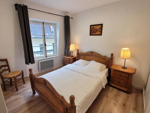 Postel nebo postele na pokoji v ubytování Les appartements Place de la Cathédrale