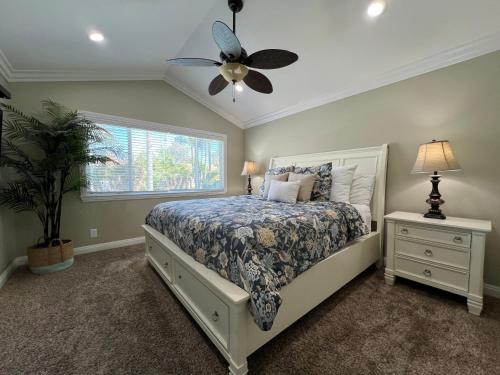 a bedroom with a bed and a ceiling fan at Destination #23 in Anaheim
