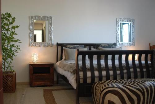 Postel nebo postele na pokoji v ubytování Tradewinds Guest House