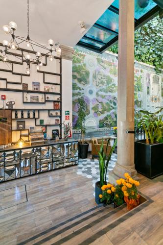 a lobby of a store with a large window at Casa Prim Hotel Boutique in Mexico City
