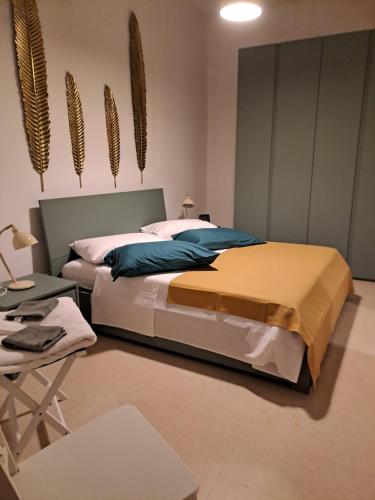 Ένα ή περισσότερα κρεβάτια σε δωμάτιο στο ORTIGIA LUXURIs DOMUs