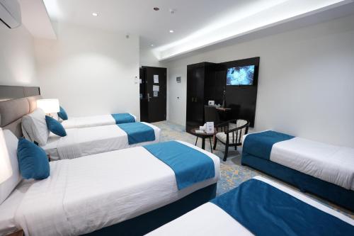 Voodi või voodid majutusasutuse Afaq Al Masi Hotel toas