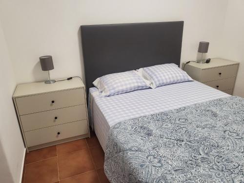 En eller flere senge i et værelse på OsTorres