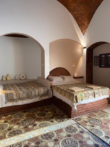 Postel nebo postele na pokoji v ubytování Bahariya Oasis hotel