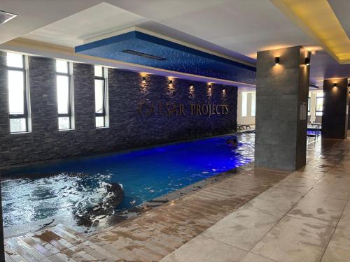 a swimming pool in the floor of a building at Caesar Blue Resort Spa Sea view apartment H-49 in Vrysoules