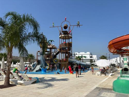 a group of people playing in a water park at Caesar Blue Resort Spa Sea view apartment H-49 in Vrysoules