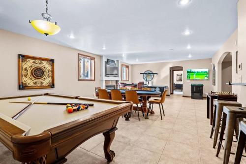 a living room with a pool table and chairs at Cabin in Tybee Island in Tybee Island