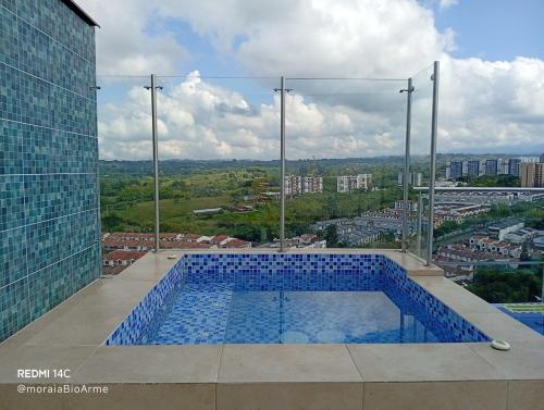 a swimming pool on top of a building at Moira Ecolodge - Armenia Laureles in Armenia