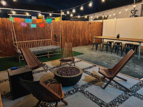 a patio with two chairs and a table and a fence at * Bueno Bueno Casita * / 7 min to Downtown / 4 Bdr in San Diego