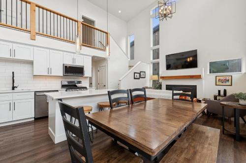 a kitchen and dining room with a wooden table and chairs at Quarry B5 in Whitefish