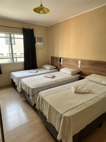 Ένα ή περισσότερα κρεβάτια σε δωμάτιο στο Exito