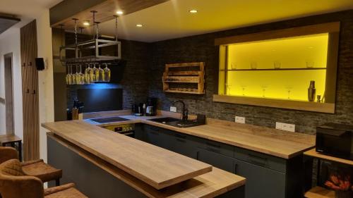 a kitchen with a counter top and a sink at Ferienhaus Strandschnecke in Dornumersiel